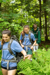 Campers walking on a trail.