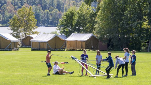 A Hulbert group doing a teambuilding activity.