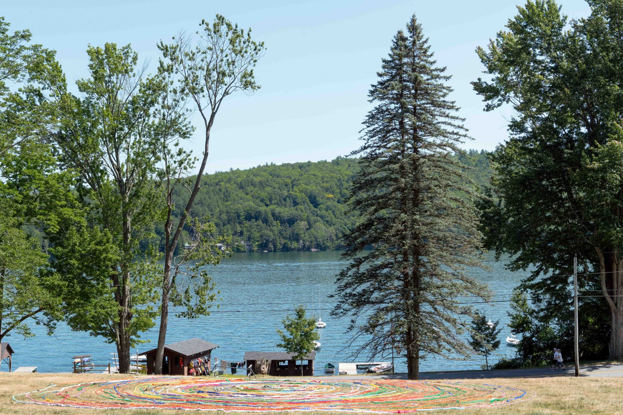 The landscape of Aloha in front of the boathouse looking out onto the lake.