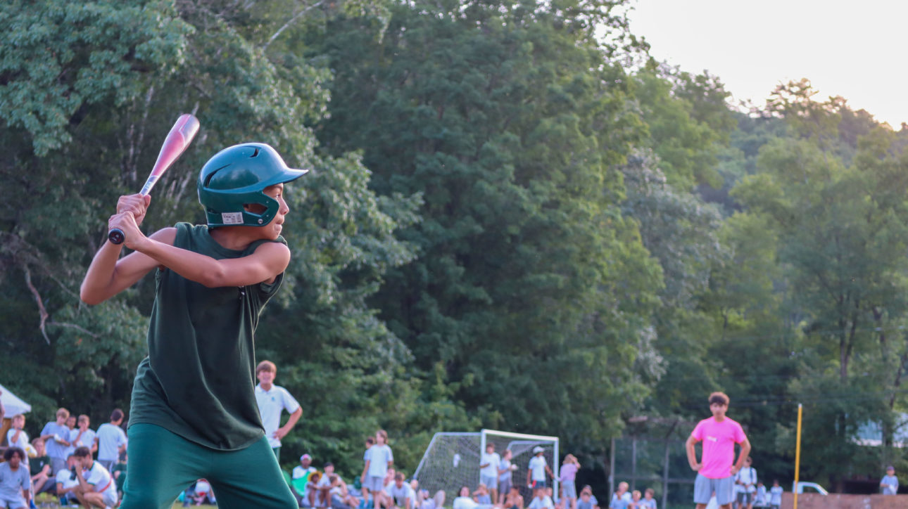 Campers playing baseball.
