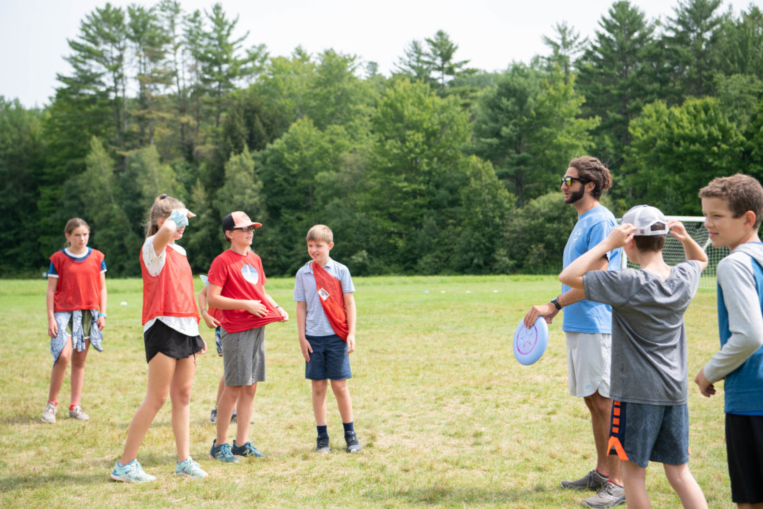 Campers playing ultimate frisbee.