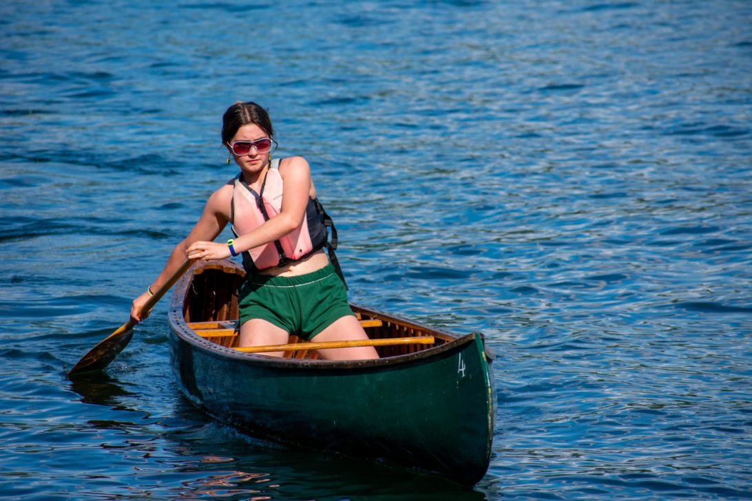 A camper canoeing.