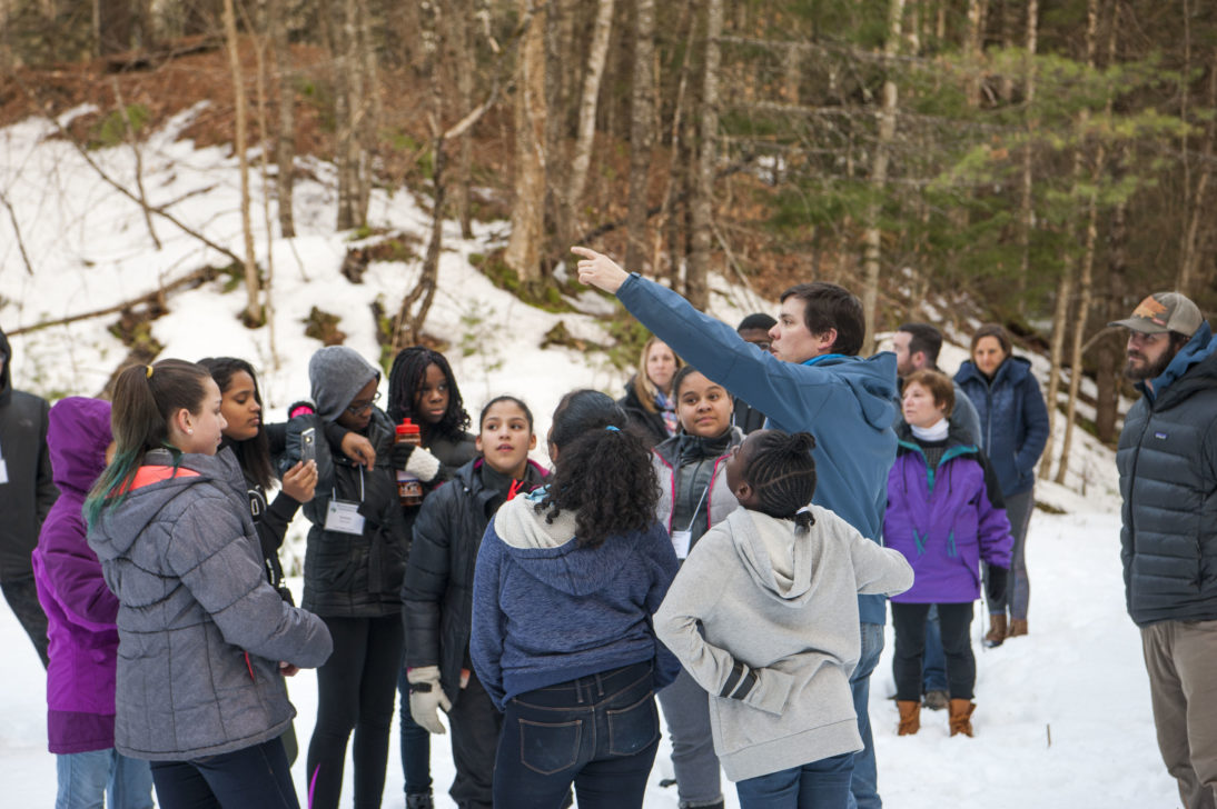 A instructor leading a team building activity during the winter.