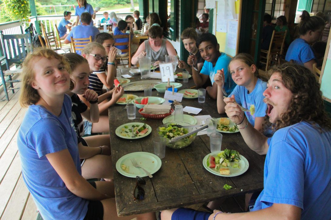 Campers having a meal together.