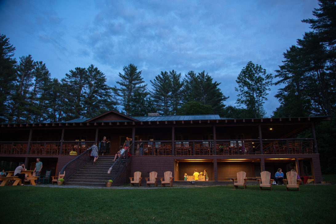 The Ohana dining (rustic wooden building) at dusk.