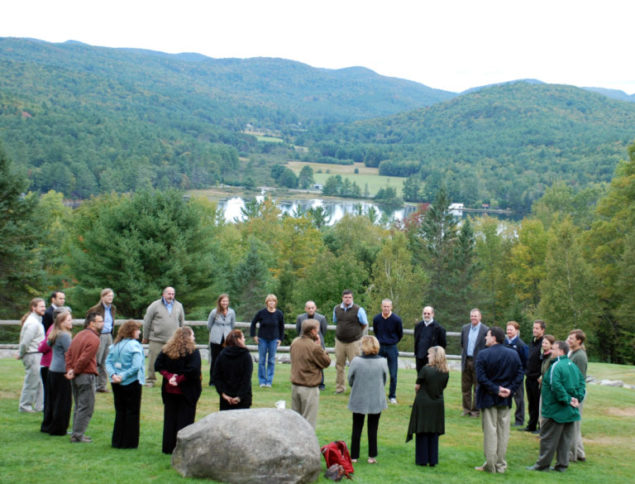 A group of of people standing in a circle.