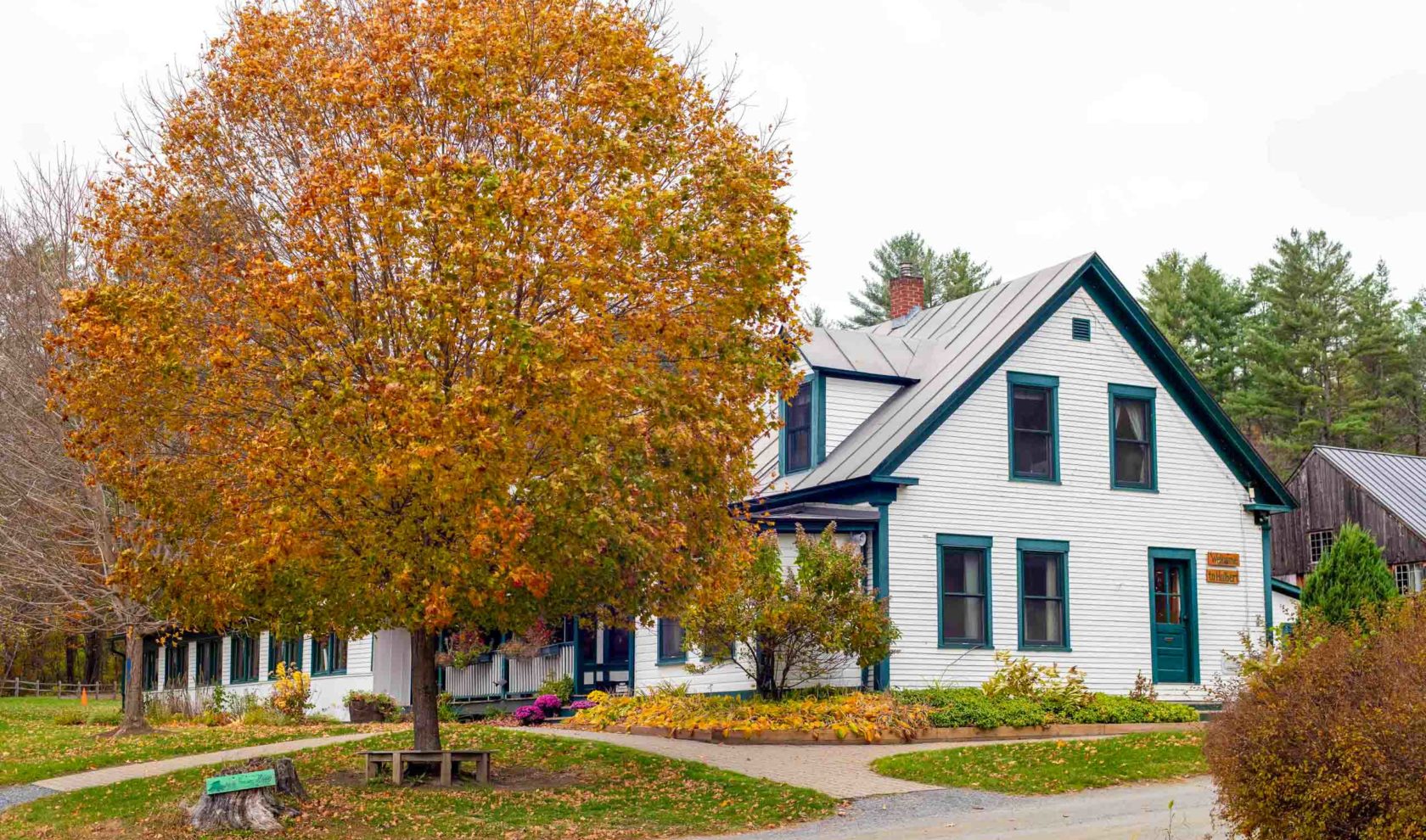The exterior of the hulbert main house in the fall.