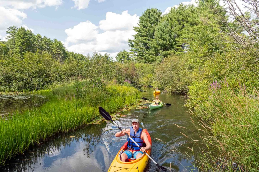 Campers kayaking down snake river at Horizons.