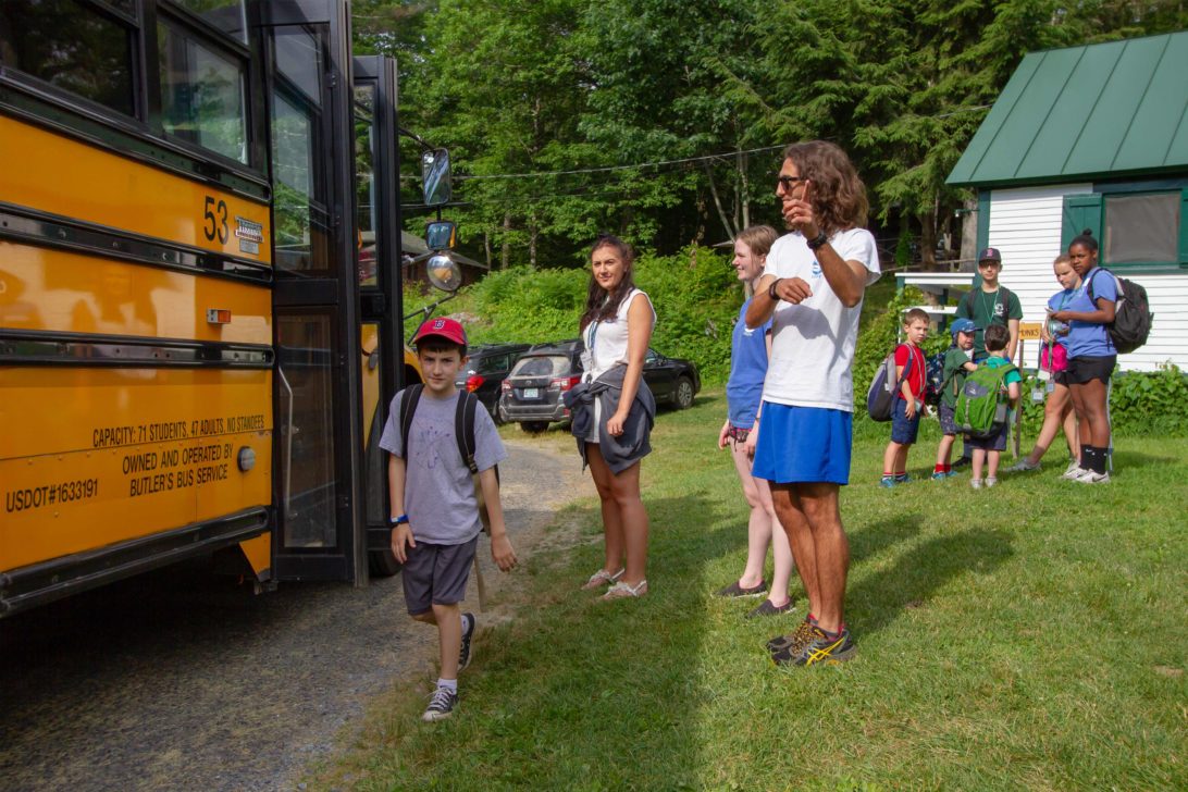 Campers waiting for a school bus.
